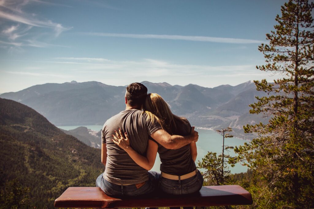 couple sitting together and enjoying mountain view